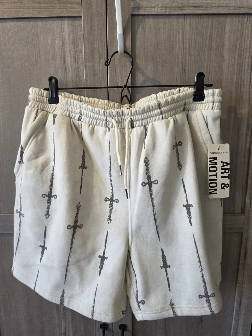 Cream Men's Athletic Shorts with Sword Print